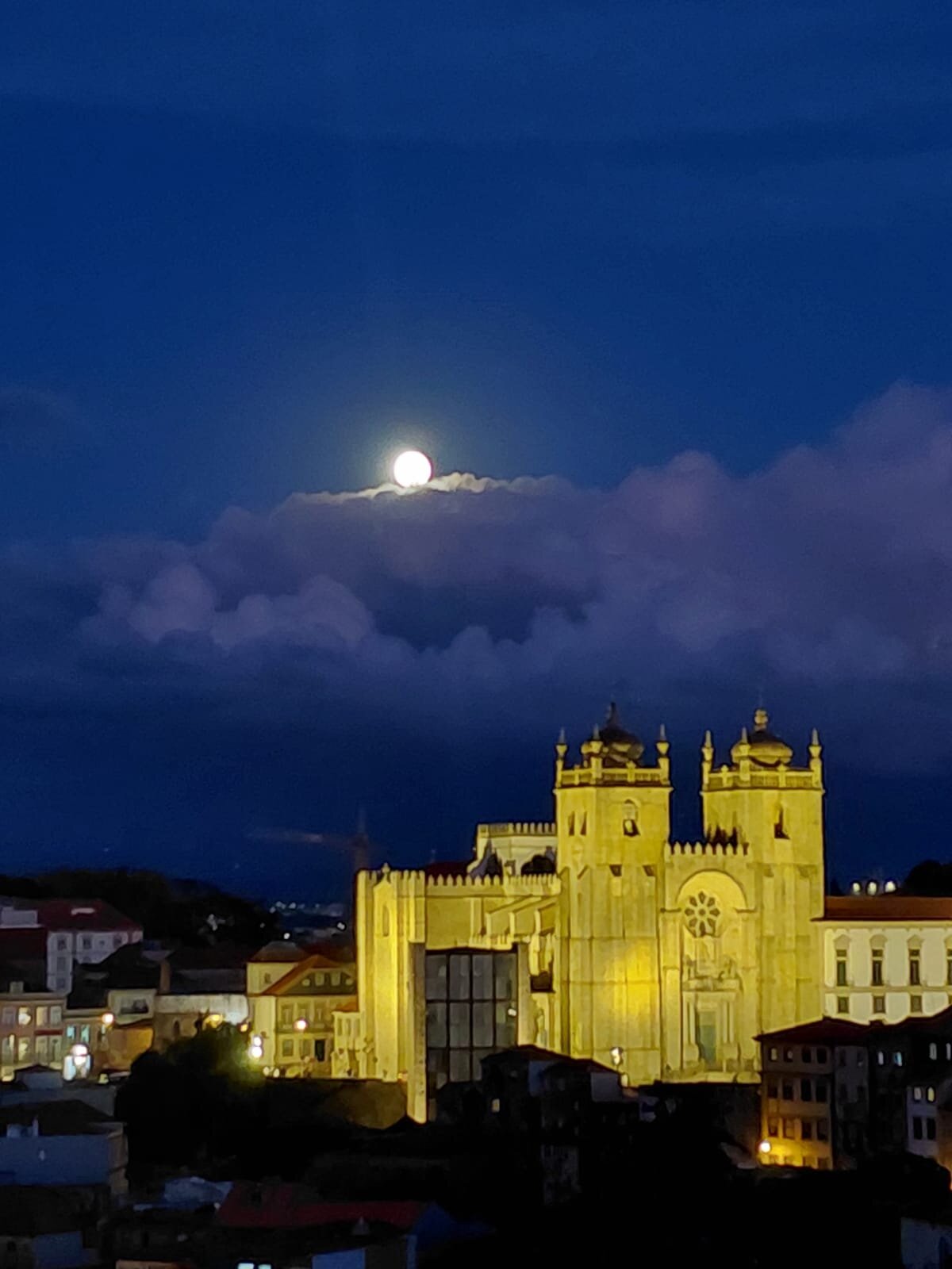 Full moon over Porto's illuminated Sé Cathedral, night view
