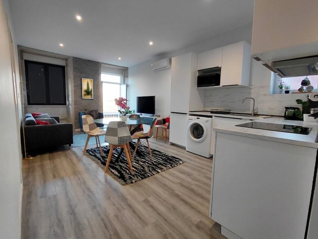 General view of the open-space concept, living room connected to the kitchen, Porto Skyline Residence
